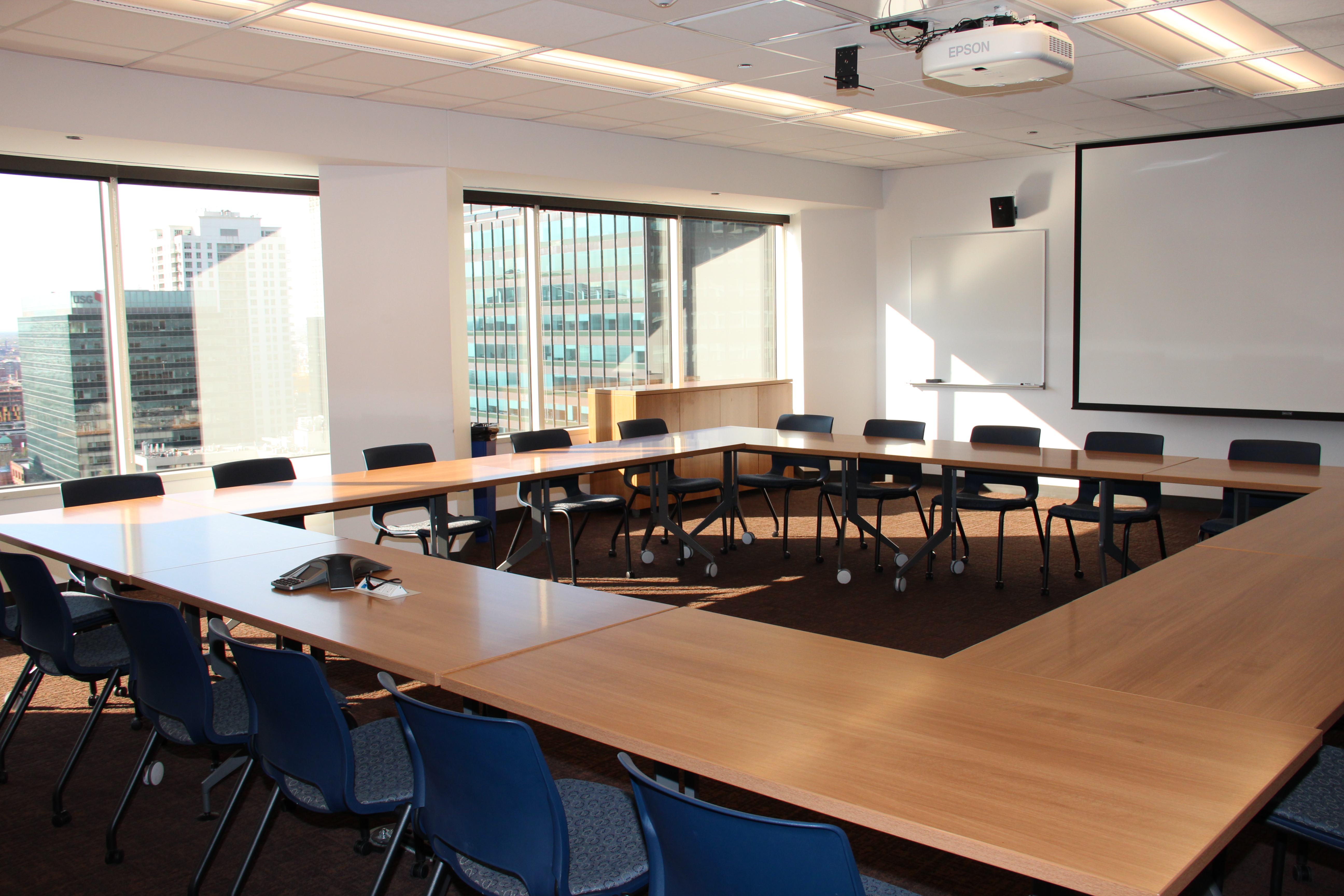 Photo of large square conference table and chairs